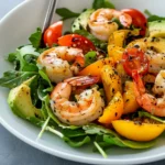 Fresh shrimp salad recipe with crisp lettuce, cherry tomatoes, avocado, and a zesty lemon dressing,